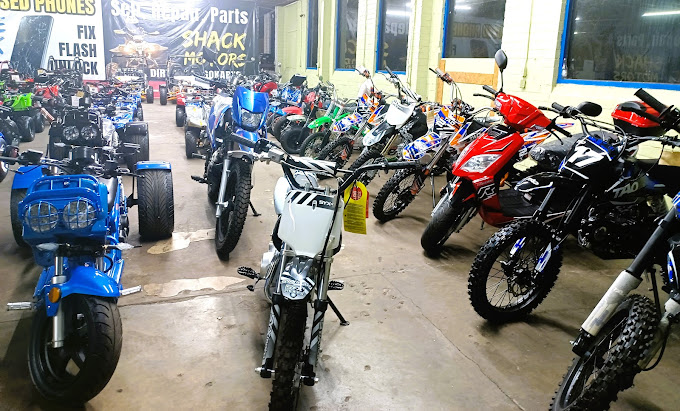 A group of motorcycles parked inside of a building