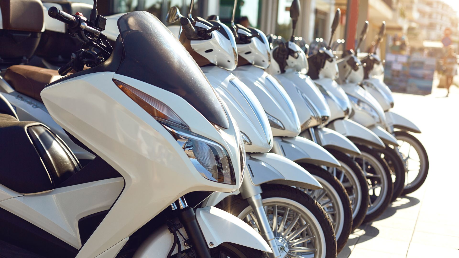 A row of motorcycles parked next to each other